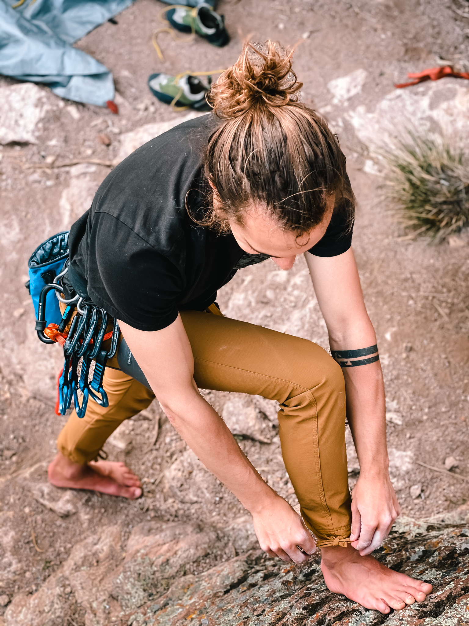 Stretching out in the Coalatree Slim Fit Trailhead Pants 